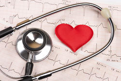 Cardiogram chart with red heart and stethoscope
